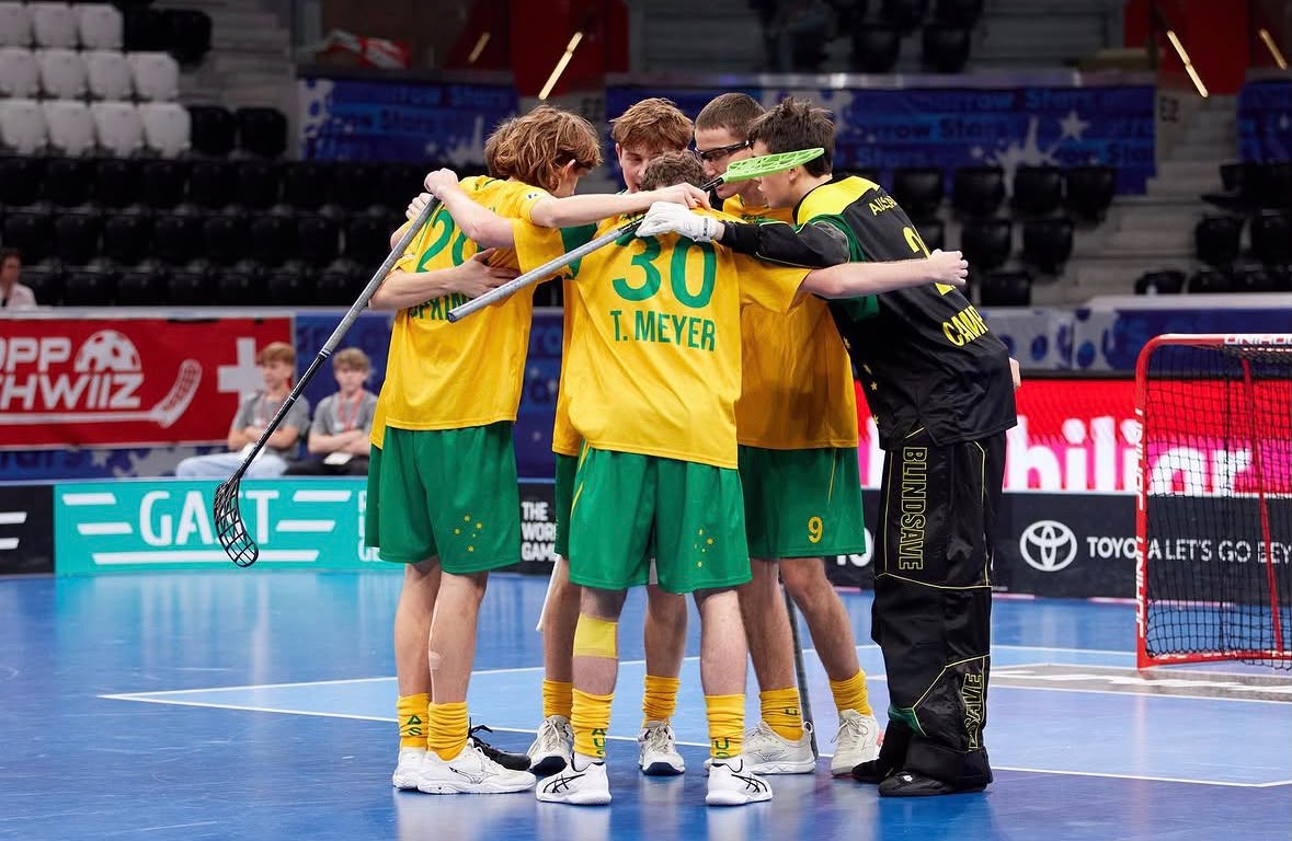 Australian floorball team huddle at international championship